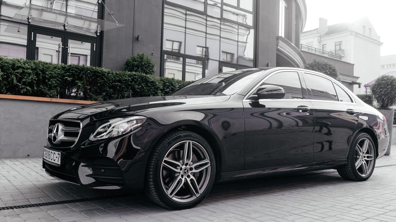 Business Sedan: Audi A6, BMW 5 Series, Mercedes E-Class or similar, with a professional driver