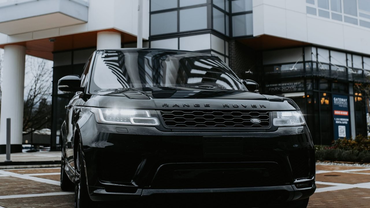 Luxury SUV: Audi Q7, BMW X7, Range Rover or similar, with a professional driver