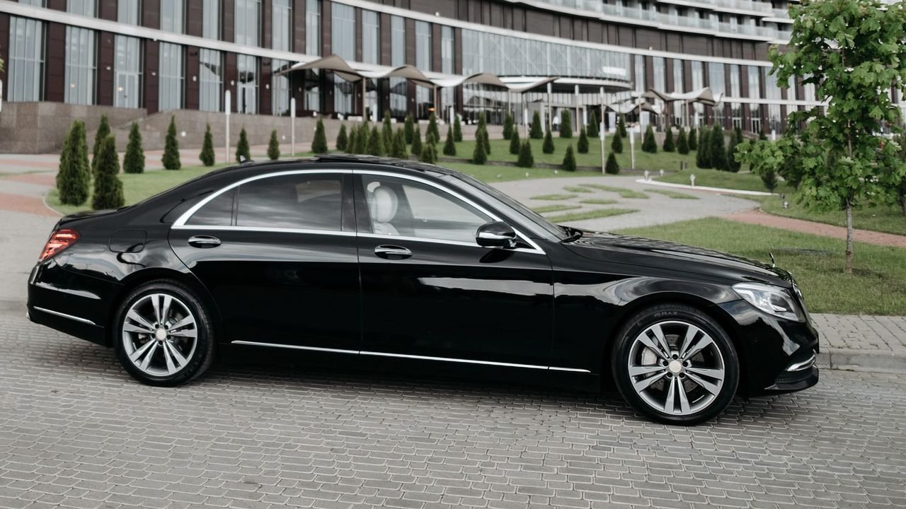 Premium Sedan: Mercedes S-Class, BMW 7 Series, Audi A8 or similar, with a professional driver