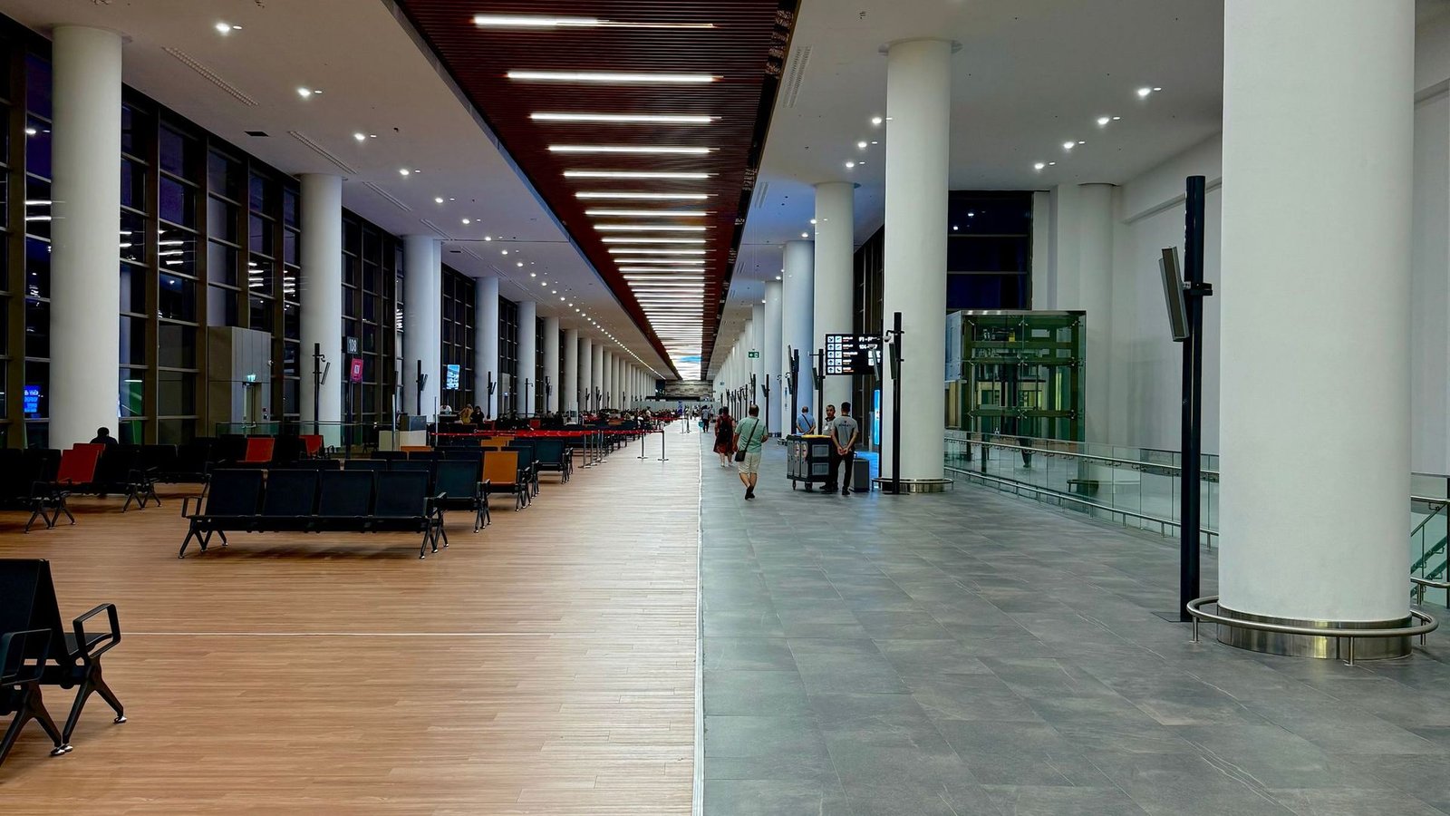 A terminal concourse lined with seating