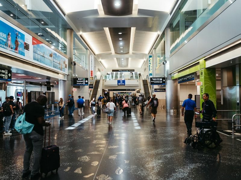 A group walking together through an airport terminal
